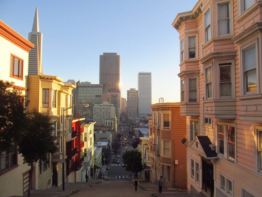 A scenic street view of San Francisco's architecture during sunset, capturing iconic skyscrapers.